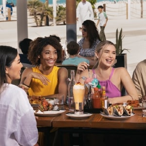 Friends eating in Abu Dhabi