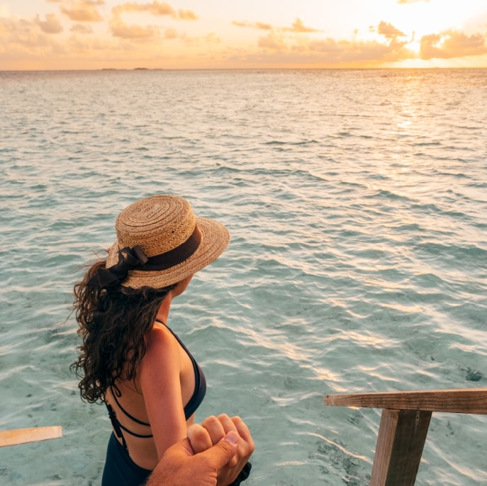 Couple watching the sunset in the Maldives