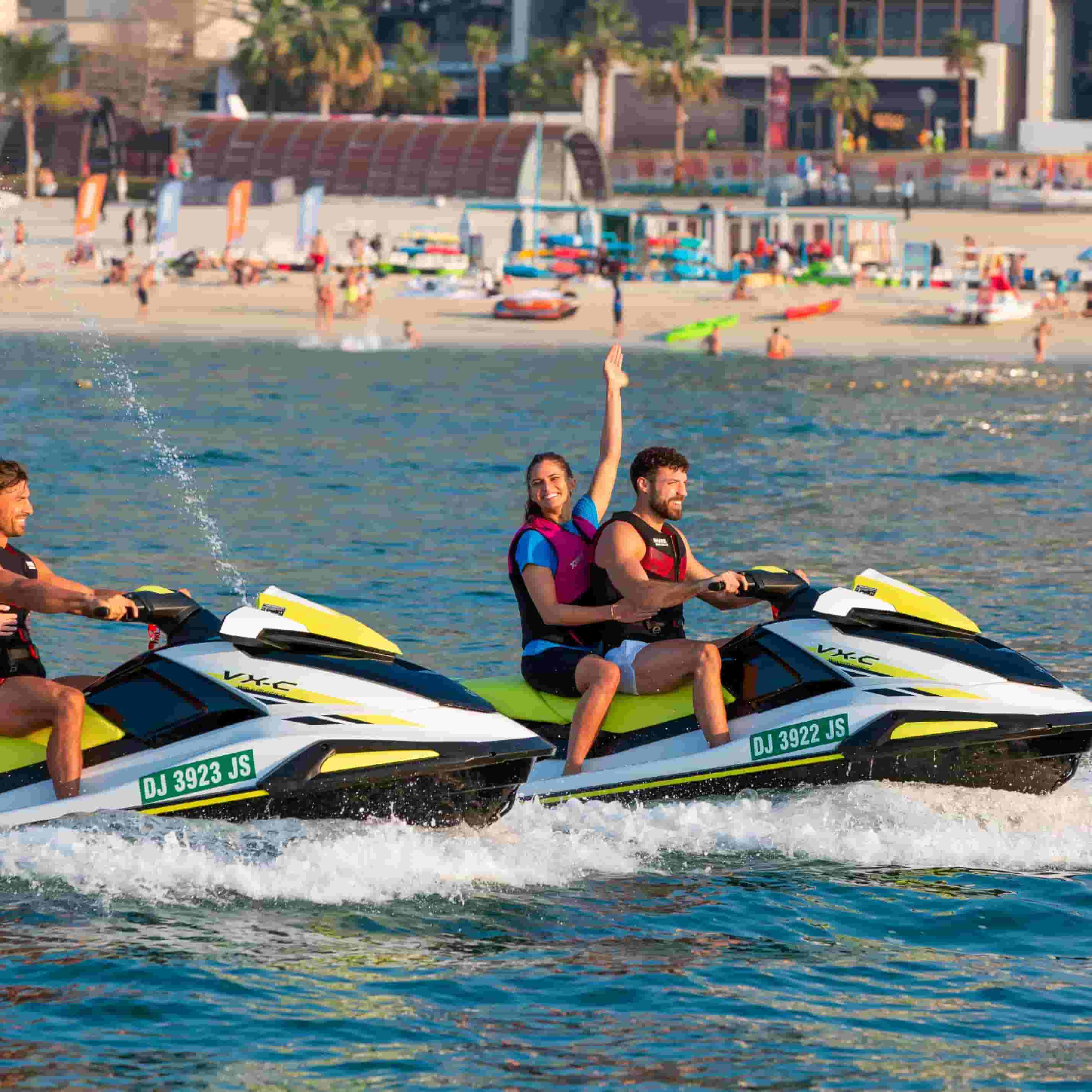Couple riding a jet ski at the Dubai beach