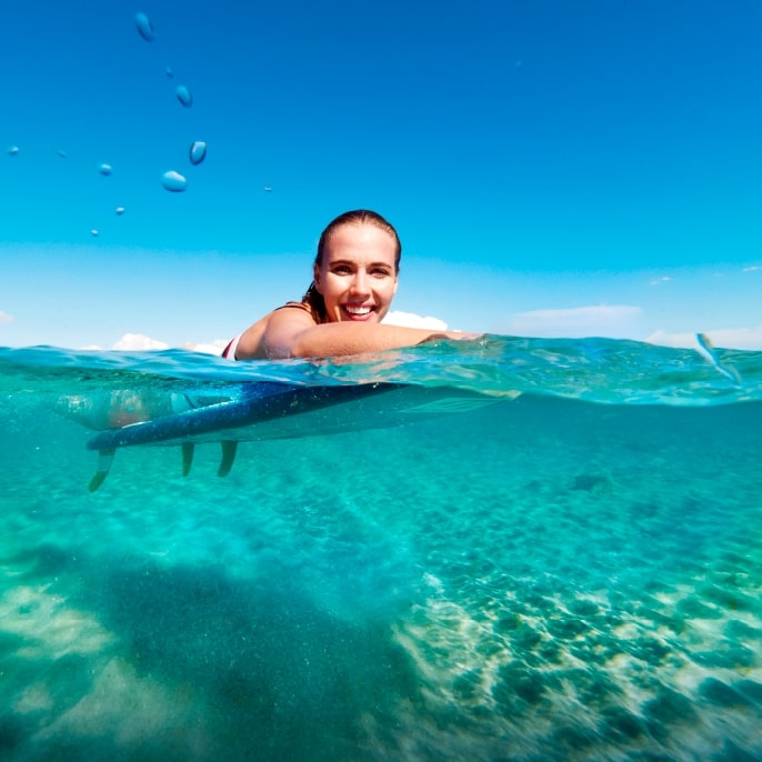Woman swimming in clear waters on the Turkaegean coast