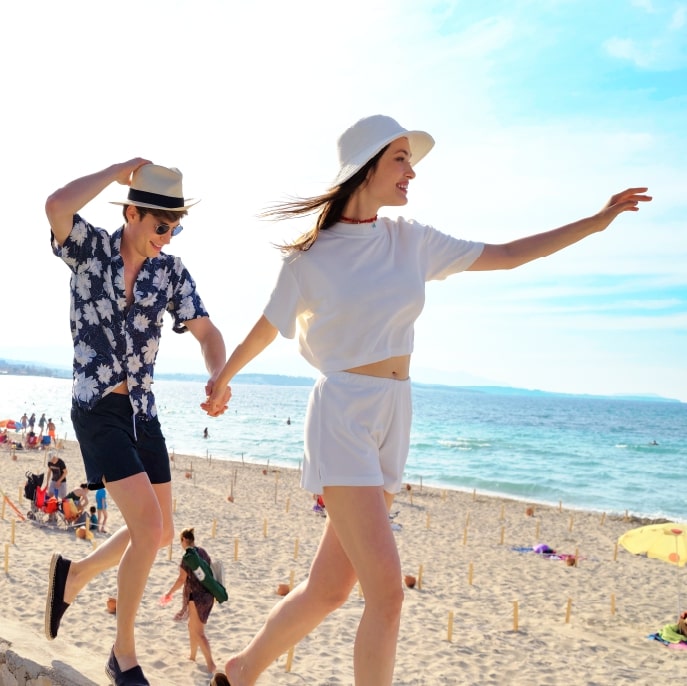 Couple walking across the beach in Turkey